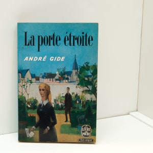 May include: A vintage paperback book cover with a blue background and a painting of a woman in a black dress standing in a garden. The title of the book is "La porte étroite" by André Gide. The cover also features the logo for "Le Livre de Poche".