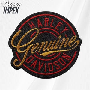 May include: Embroidered patch with the words "HARLEY DAVIDSON Genuine" in gold and red on a black background. The patch has a circular shape with a red border and is likely for a jacket or vest.