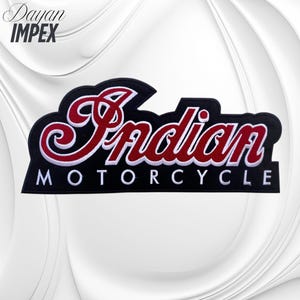 May include: A black patch with the word "Indian" in red script and white trim, above "Motorcycle" in white block letters. The patch has a black border and a stylized shape. The text "Dayan IMPEX" is in the upper left corner.