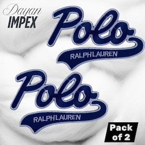 May include: Two navy blue embroidered Polo Ralph Lauren patches. The word "Polo" is in a cursive font, with "RALPHLAUREN" embroidered below. The patches are on a white, textured background. The text "Pack of 2" is in the bottom right corner.