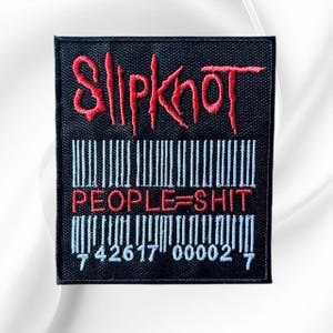 May include: A rectangular black embroidered patch featuring the red Slipknot logo at the top. Below the logo is a white barcode graphic with the red text PEOPLE=SHIT centered across it, followed by the white numerical sequence 42617 00002.