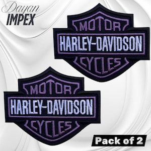 May include: Two black Harley-Davidson patches with purple and white embroidered text. The patches feature the Harley-Davidson logo, including the words "MOTOR," "HARLEY-DAVIDSON," and "CYCLES." The patches are sold as a pack of two.