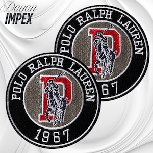 May include: Two circular patches featuring the Polo Ralph Lauren logo. The patches have a black border with white text that reads "POLO RALPH LAUREN" and "1967". The center features a red "P" with a polo player and a gray background.