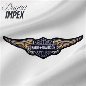 May include: Embroidered Harley-Davidson patch featuring a black, gold, and silver winged design. The patch includes the text "MOTOR HARLEY-DAVIDSON CYCLES" in a rectangular frame. The brand name "Dayan IMPEX" is in the upper left corner.