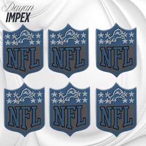 May include: Six embroidered patches featuring the Detroit Lions NFL logo. Each patch has a blue shield shape with a gray NFL text, a lion graphic, and white stars. The patches are arranged in two rows of three.