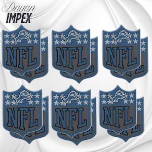 May include: A collection of six Detroit Lions NFL team logo patches. Each patch features a blue shield shape with a lion and stars, and the letters "NFL" in gray. The patches are arranged on a white background.