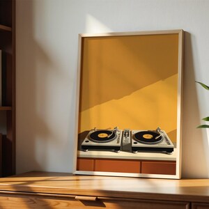 A framed art print showing turntables is displayed on a wooden cabinet next to a bookshelf and a potted plant.