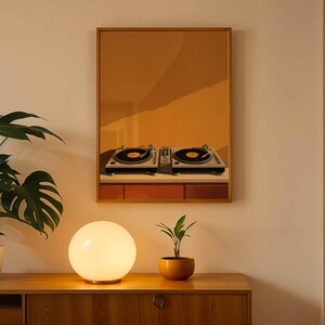 A framed mustard yellow print of turntables hangs on a wall above a wooden cabinet with a globe lamp and potted plants.