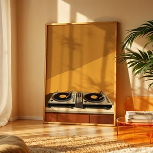 A framed turntable wall art print rests on the floor in a sunlit room with potted plants and sheer curtains.