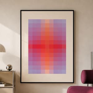 Puede incluir: Una lámina de arte mural enmarcada que presenta una cuadrícula de cuadrados en un degradado de colores, que transita desde el violeta claro en los bordes hasta un centro rojo y naranja vibrante. La obra tiene un marco negro fino y paspartú.
