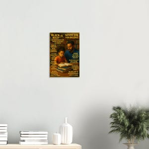 May include: A poster with the text "Black is Bold" and "Never Dim Your Brilliance". The poster features a father and child reading books. The poster has a brown background with black text.