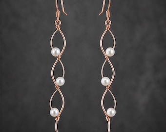 Long delicate earrings, wavy rose gold wire woven with genuine pearl, line art jewelry