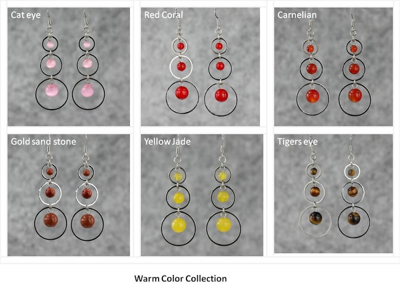 May include: A collection of six pairs of dangle earrings with silver hoops and gemstone beads. The earrings feature warm colors, including red coral, carnelian, gold sand stone, yellow jade, and tiger's eye. The earrings are labeled with their corresponding gemstone names. The text "Warm Color Collection" is displayed at the bottom of the image.