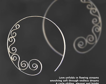 May include: A pair of silver hoop earrings with a delicate, swirling design. The earrings are shown against a black background.