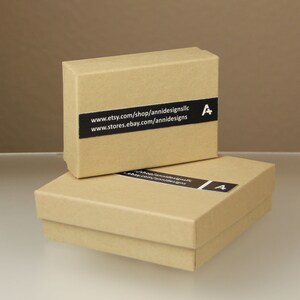 May include: Two brown cardboard boxes with a black label on each. The label on the top box reads "www.etsy.com/shop/annidesignsllc www.stores.ebay.com/annidesigns". The label on the bottom box reads "shop/annidesignsllc ebay.com/annidesigns".