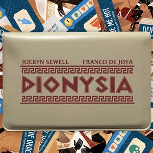 May include: A board game box titled "Dionysia" in a serif font, with the names Joebyn Sewell and Franco de Joya above. The box is tan, with a red design. Game cards with illustrations and text surround the box.
