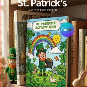 Può includere: Un libro di attività per bambini di San Patrizio, con un'illustrazione colorata di un folletto, un arcobaleno e un pentolone d'oro. Il libro è esposto su una mensola di legno con altri libri e una statuina di folletto. La copertina recita "St. Patrick's Activity Book".