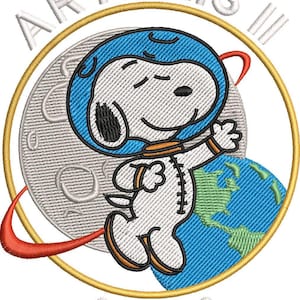 May include: Embroidered patch featuring Snoopy in a blue astronaut helmet and spacesuit, floating in space. The patch includes the text "ARTEMIS III" and "NASA" in white, with a gold border and a depiction of Earth and the moon.