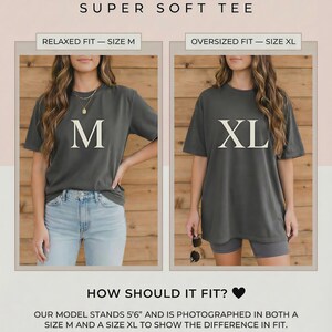 May include: Image showing a sizing reference for a Super Soft Tee. The text includes "Relaxed Fit - Size M" and "Oversized Fit - Size XL". Two women are modeling the shirts. The text "How Should It Fit?" is also included.