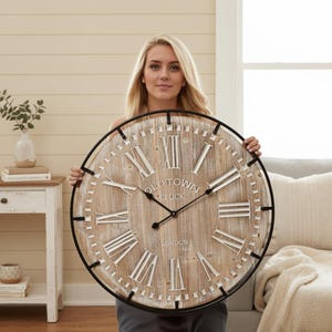 May include: Large round wall clock with a distressed wood-effect face and black metal frame. The clock features white Roman numerals and the words "OLD TOWN CLOCK LONDON". A decorative piece for home decor, approximately 76 cm in diameter.