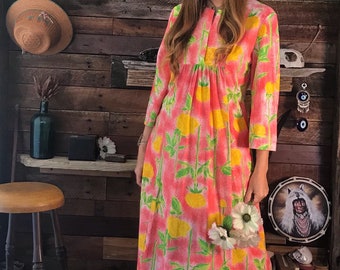 Beautiful 1960’s ‘Butterfield 8’ Maxi dress featuring a vibrant pink and yellow rose print and sweet bib bodice with empire waist.