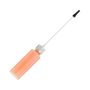May include: A clear plastic bottle filled with an orange liquid, featuring a silver cap and a long, thin metal applicator with a black tip. The bottle is angled diagonally against a white background.