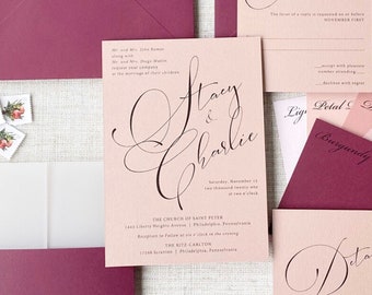 May include: Wedding invitation suite with a blush pink and burgundy color scheme. The invitation features calligraphy text that reads "Stacy & Charlie". The RSVP card reads "Reply". The details card reads "Details".