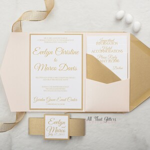 May include: A blush pink and gold wedding invitation with the text "Evelyn Christine to Marco Davis" and "Garden Grove Event Center" in gold script font. The invitation includes a separate card with the text "Important Information Hotel Accommodations Please Reply May 20, 2016" in gold script font. The invitation is tied with a gold ribbon and includes a small square card with the text "Evelyn and Marco July 12, 2017" in gold script font.