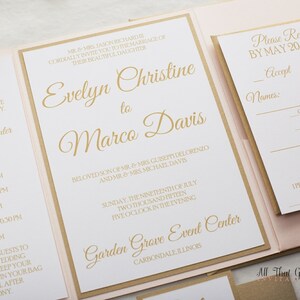 May include: A white wedding invitation with gold lettering. The invitation is for the wedding of Evelyn Christine and Marco Davis. The wedding will be held on Sunday, July 19, 2015 at 5:00 PM at the Garden Grove Event Center in Carbondale, Illinois.