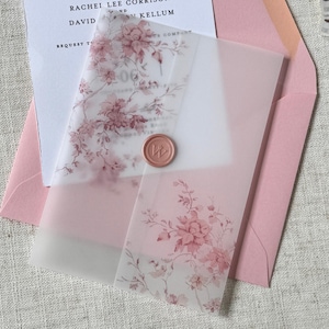 May include: A wedding invitation suite featuring a pink envelope, a floral vellum overlay, and a white invitation card. The vellum is adorned with pink floral patterns and a wax seal. The invitation card has the names "RACHEL LEE CORRISON" and "DAVID KELLUM".