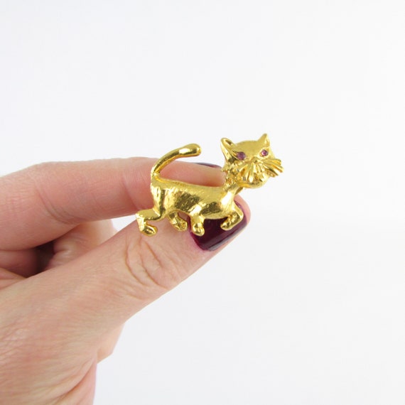 Bronze-y gold with malachite necklace. Cat brooch