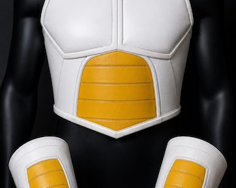 May include: White and yellow cosplay armor set, including a chest piece and two arm guards. The armor features a segmented design with yellow accents on a white base, and is displayed on a black mannequin.