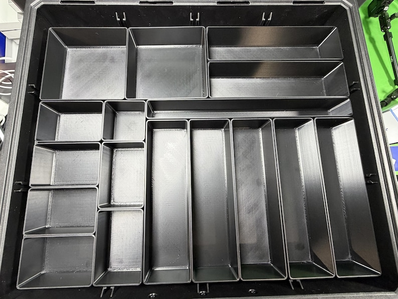 a metal tray with multiple compartments, designed for organizing and storing various items.