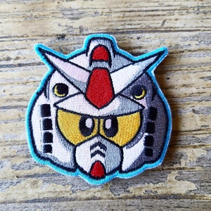 Mobile suit patch with hook and loop backing