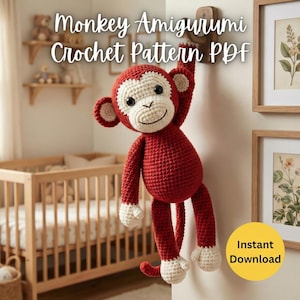 以下が含まれることがあります： 赤とクリーム色の編みぐるみの猿が木のペグからぶら下がっています。猿は笑顔で、質感のある糸で作られています。画像には「Monkey Amigurumi Crochet Pattern PDF」と「Instant Download」の文字が含まれています。