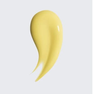 K&ouml;nnte beinhalten: Ein glattes, gelbes Kosmetikprodukt, m&ouml;glicherweise eine Creme oder Lotion, wird vor einem hellgrauen Hintergrund gezeigt. Das Produkt hat eine geschwungene, tropfenf&ouml;rmige Form mit gl&auml;nzendem Glanz, was auf eine reichhaltige Textur hindeutet.