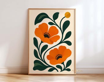 Könnte beinhalten: Ein rechteckiger Wandkunstdruck in einem hellen Holzrahmen mit einer grafischen Illustration von zwei großen orangefarbenen Blumen mit dunklen Zentren und dunkelgrünen Blättern auf cremefarbenem Hintergrund sowie einem kleinen gelben Kreis oben rechts.