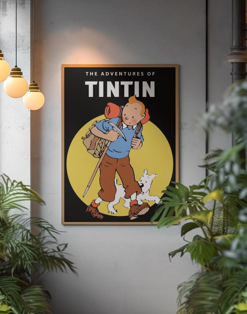 May include: A framed poster featuring Tintin and Snowy from "The Adventures of Tintin." The artwork depicts Tintin in a blue shirt and brown pants, carrying a backpack and walking stick, with Snowy running alongside. The background is a yellow circle against a black backdrop.