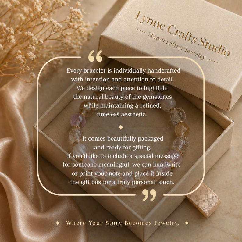 May include: A handcrafted gemstone bracelet inside a gift box. The box is beige with the text "Lynne Crafts Studio Handcrafted Jewelry." The bracelet features various colored stones. The box is on a satin surface.