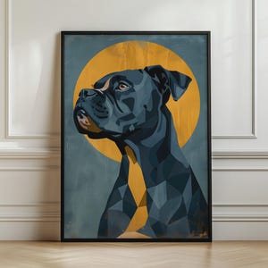 May include: A framed wall art print featuring a geometric, stylised portrait of a dark-coloured boxer dog. The dog is depicted in shades of charcoal and navy against a muted blue background with a large, circular golden-yellow sun-like shape behind.