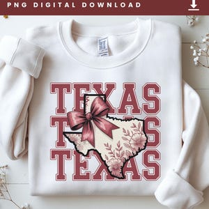 May include: White sweatshirt with the word "TEXAS" in maroon block letters. The state of Texas is illustrated with a maroon bow and floral design. The words "PNG DIGITAL DOWNLOAD" are at the top.