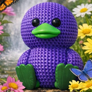 May include: A purple duck-like plush toy with a green beak and feet, and black eyes. The toy is surrounded by colorful flowers and butterflies, creating a whimsical scene. The plush has a textured surface.