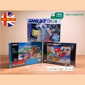 May include: Three vintage video game boxes: Game Boy Color, Super Mario Kart for Super Nintendo, and Super Mario 64 for Nintendo 64. The boxes feature colorful graphics and text, including "Game Boy Color" and "Super Mario".