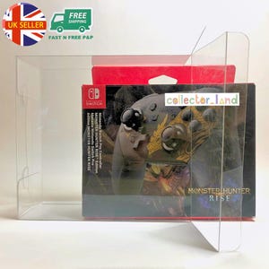 May include: A clear plastic display case containing a Nintendo Switch Pro Controller. The controller is in a box with the "MONSTER HUNTER RISE" logo. The box is red and black with the text "Nintendo Switch Pro Controller Monster Hunter Rise Edition".