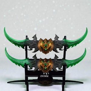 May include: A set of three ceramic mugs with a speckled, matte finish. The mugs are in shades of cream, light gray, and dark gray. Each mug has a simple, minimalist design and a rounded handle.