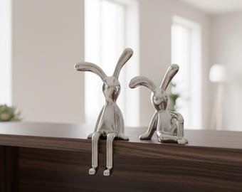 2-delige konijnstandbeeldset, kleine glanzende konijntjesornamenten voor kamerdecoratie, schattige zittende figuren, modern minimaal bureau of plankdecor