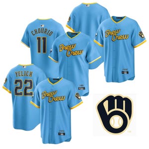 May include: Light blue baseball jerseys with yellow trim and the words "Brew Crew" in yellow script. Jerseys feature player names and numbers, including "Chourio 11" and "Yelich 22". A team logo is also visible.