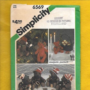 May include: Simplicity sewing pattern 6569 featuring teddy bear designs. The cover includes images of teddy bears in festive settings, including Christmas decorations and a musical ensemble. The price is $4.50.