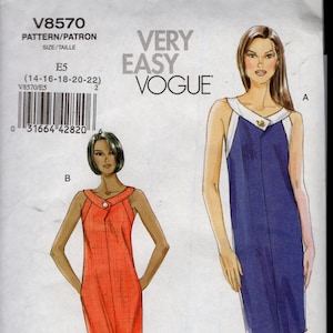 May include: Vogue pattern V8570 showing two dress designs. One dress is navy blue with white trim, the other is orange. The pattern is labelled "Very Easy Vogue" and includes size options.