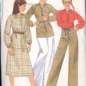 May include: Vintage Butterick sewing pattern featuring three women's fashion designs. The pattern includes a dress, a tunic with pants, and a blouse with pants. The cover displays the Butterick logo, the number 5986, and the designer's name, Willi Smith.